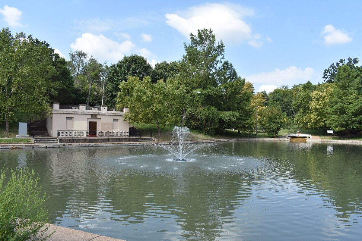 The lake at Clifton Heights Park, with its fountain and the old boat house among the trees